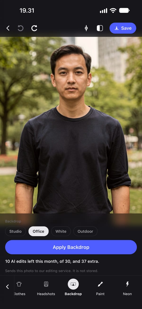The Backdrop tool before it is applied, on a waist-up photo of a young man in a black T-shirt in a park. Office is selected from the four backdrops: Studio, Office, White and Outdoor.
