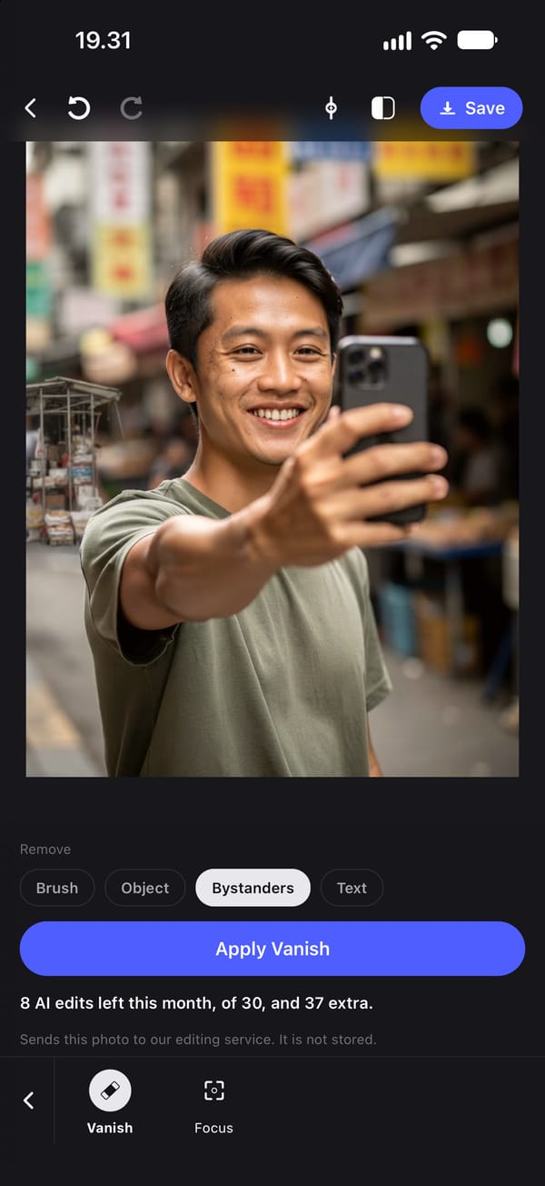 The same selfie after Apply Vanish with Bystanders: the passers-by are gone, and the model has filled the space behind him with more of the street, here a market stall.